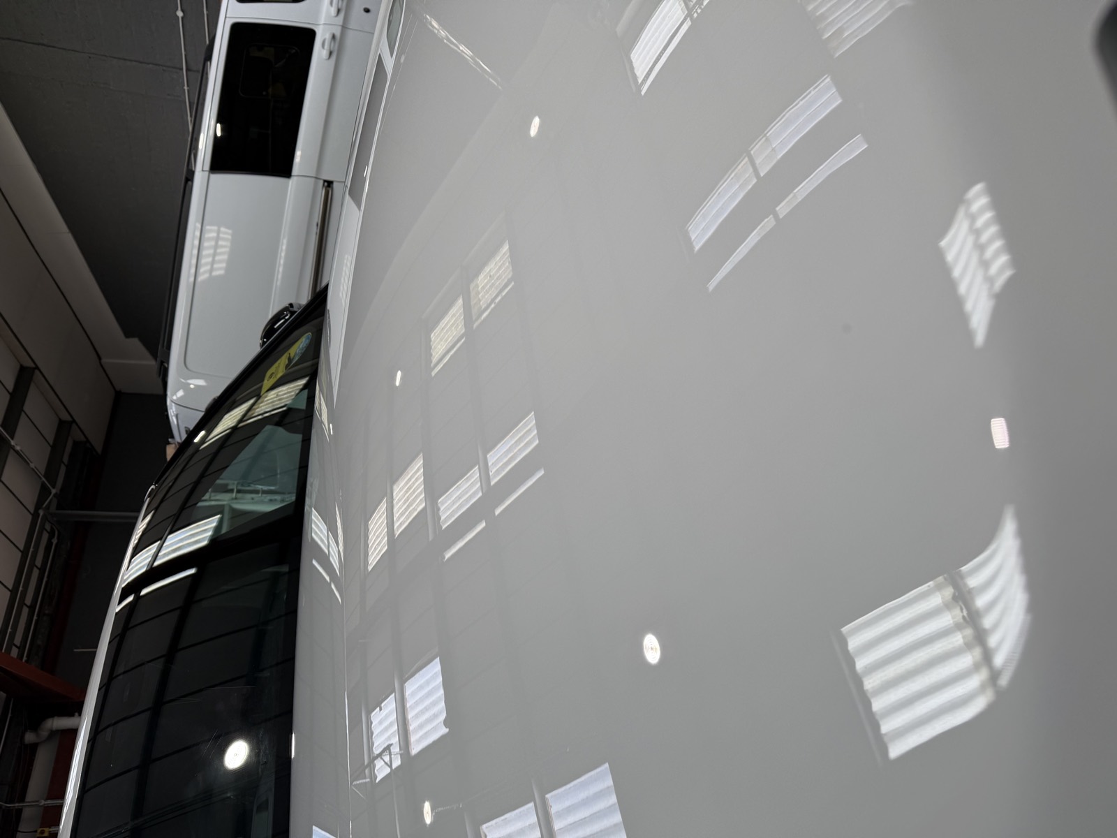 A polished Range Rover bonnet, mirror gloss under the unit lights