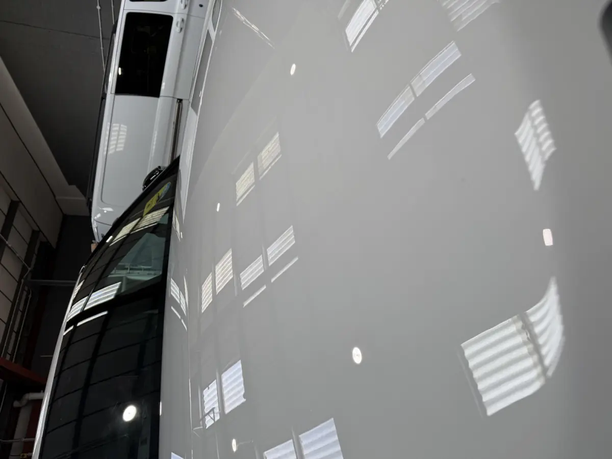 A polished Range Rover bonnet, mirror gloss under the unit lights